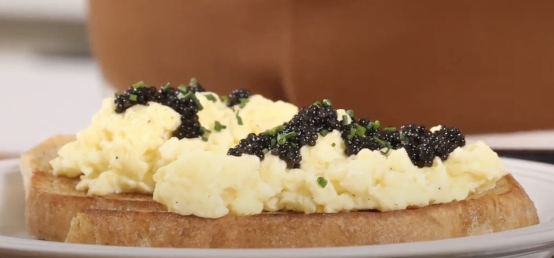 Soft scrambled eggs on toast with caviar